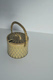 Sugar bowl with brass and wicker handle designed by Jens H. Quistgaard