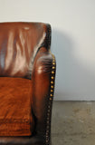 Club chair with original leather from 1920s